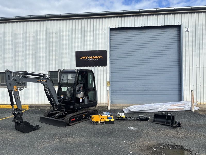 Jay-Hawk JHM30 with the full attachment bundle staged at the shed