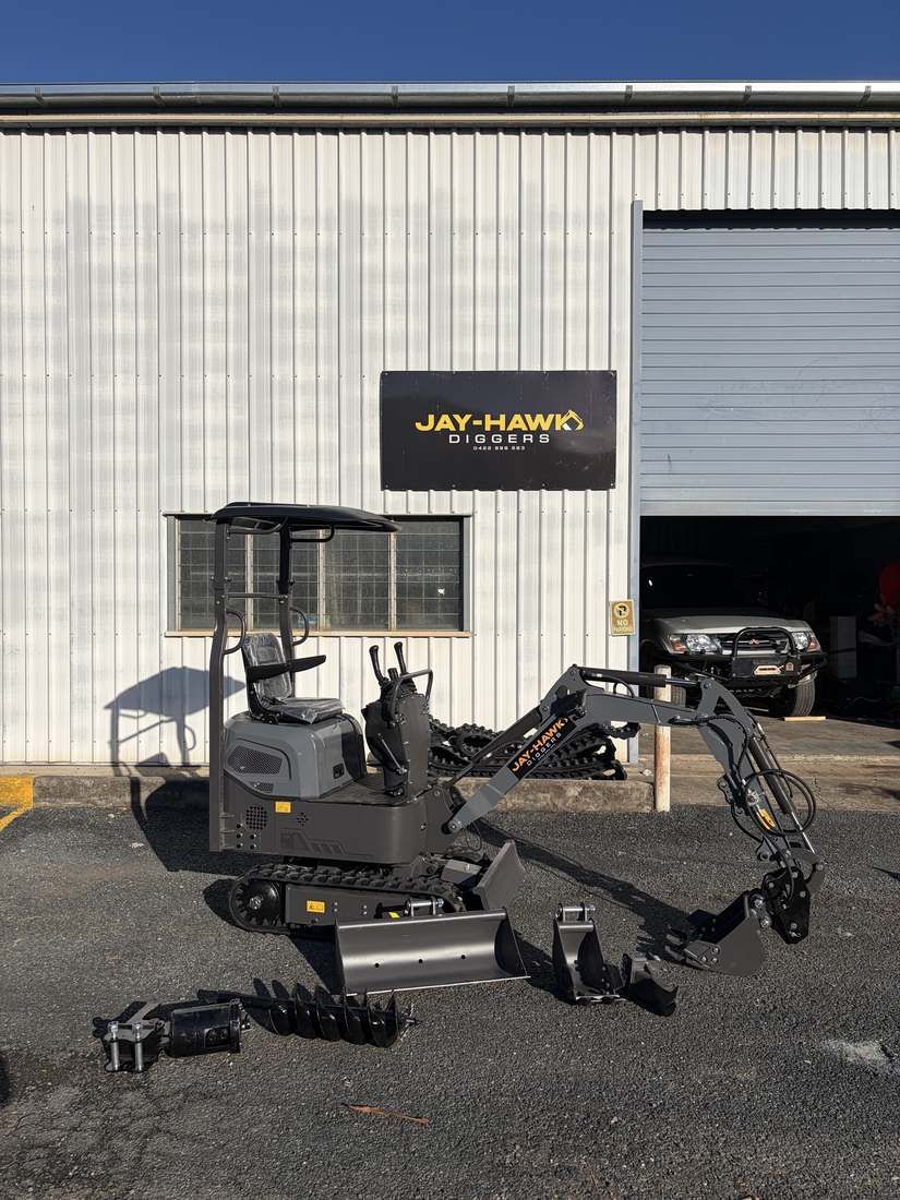 JHM10 mini excavator with auger attachment at the Jay-Hawk Diggers yard