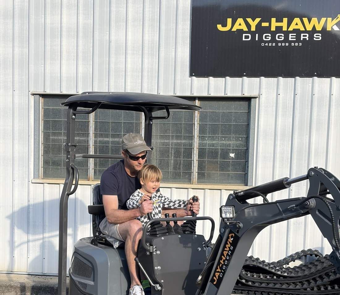JHM10 mini excavator being operated at the Jay-Hawk Diggers yard