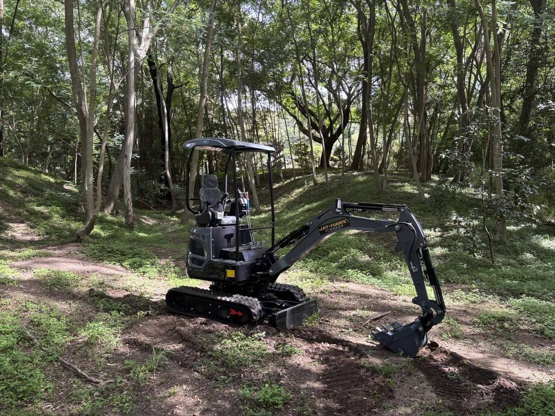 JHM14 mini excavator in a forest clearing